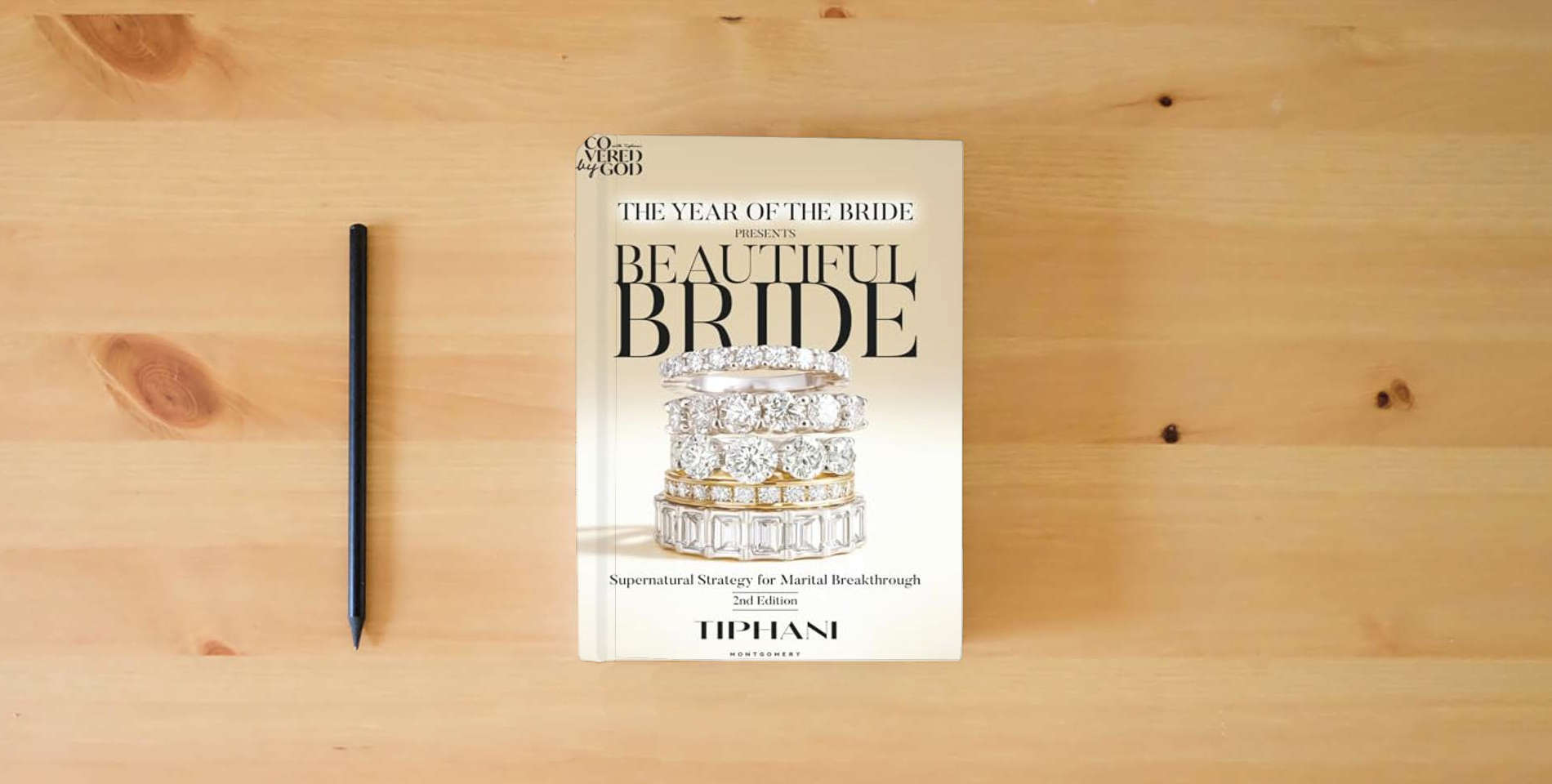 The book The Year of the Bride Presents: Beautiful Bride: Supernatural Strategies for Marital Breakthrough is on the table