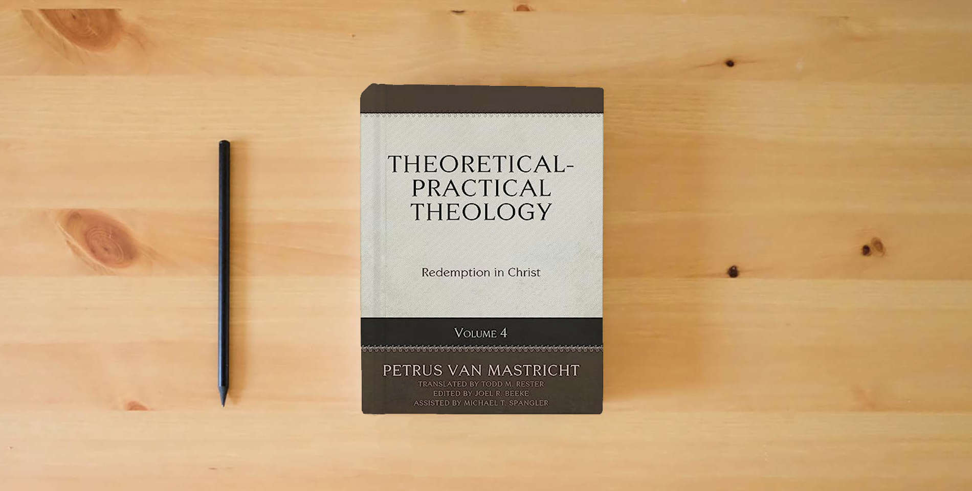 The book Theoretical-Practical Theology Volume 4: Redemption in Christ is on the table