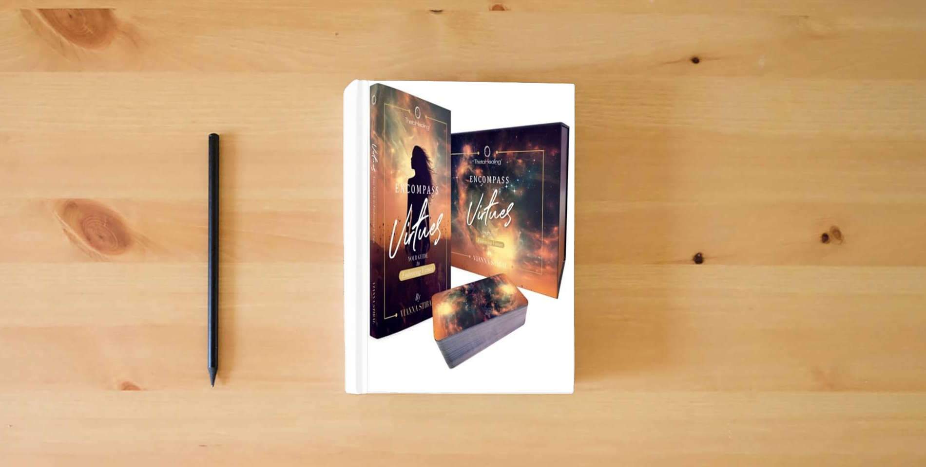 The book ThetaHealing Virtues Cards with Gold Paper Back Book is on the table