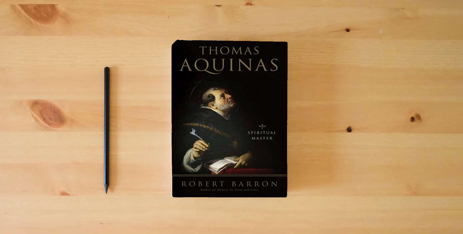 The book Thomas Aquinas: Spiritual Master is on the table