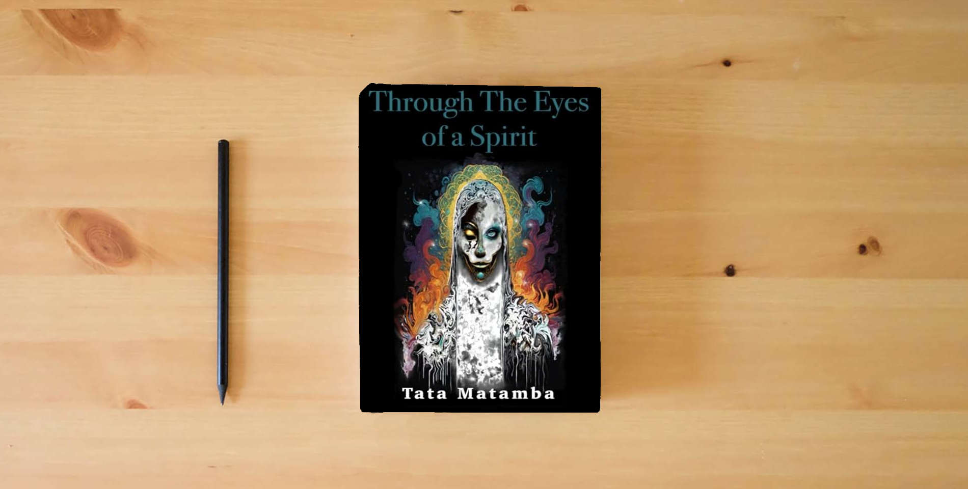 The book Through the eyes of a spirit: Tata Matamba is on the table
