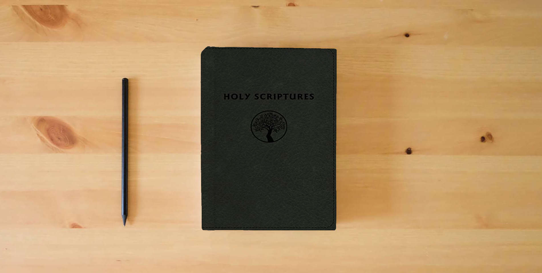 The book TLV Personal Size Giant Print Reference, Holy Scriptures, Black LeatherTouch is on the table