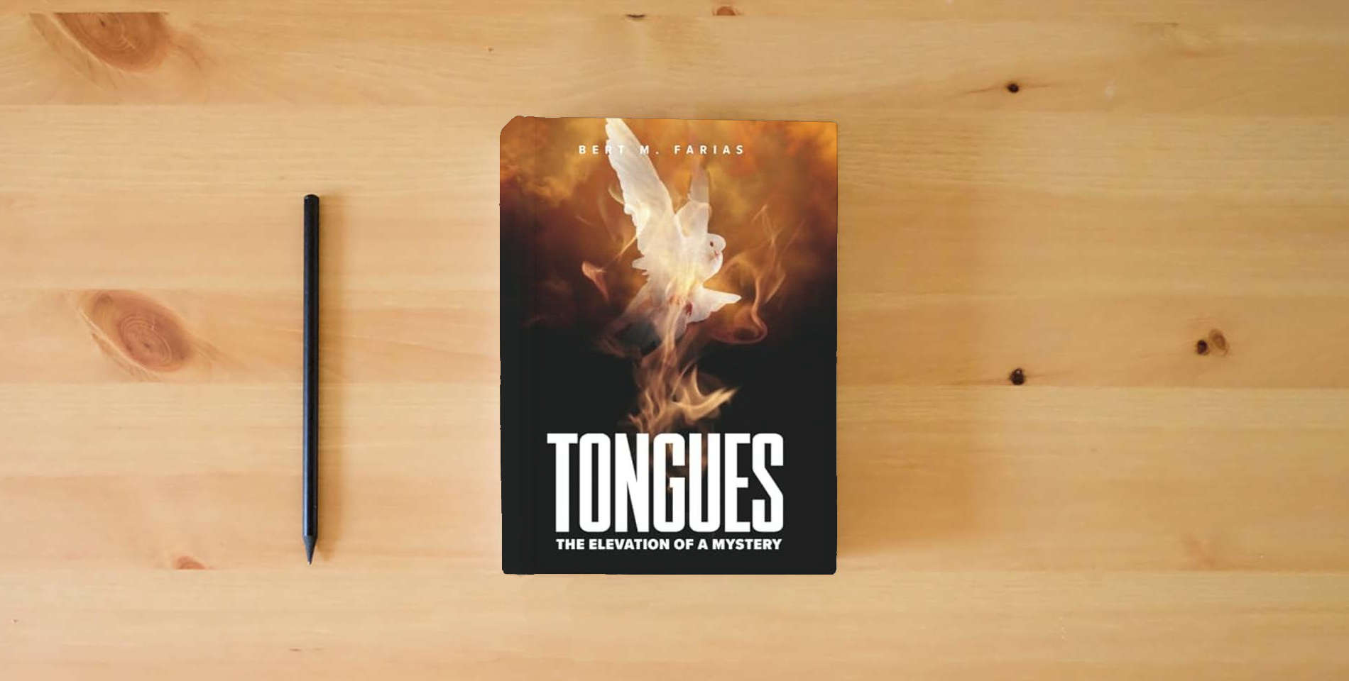 The book TONGUES: THE ELEVATION OF A MYSTERY is on the table