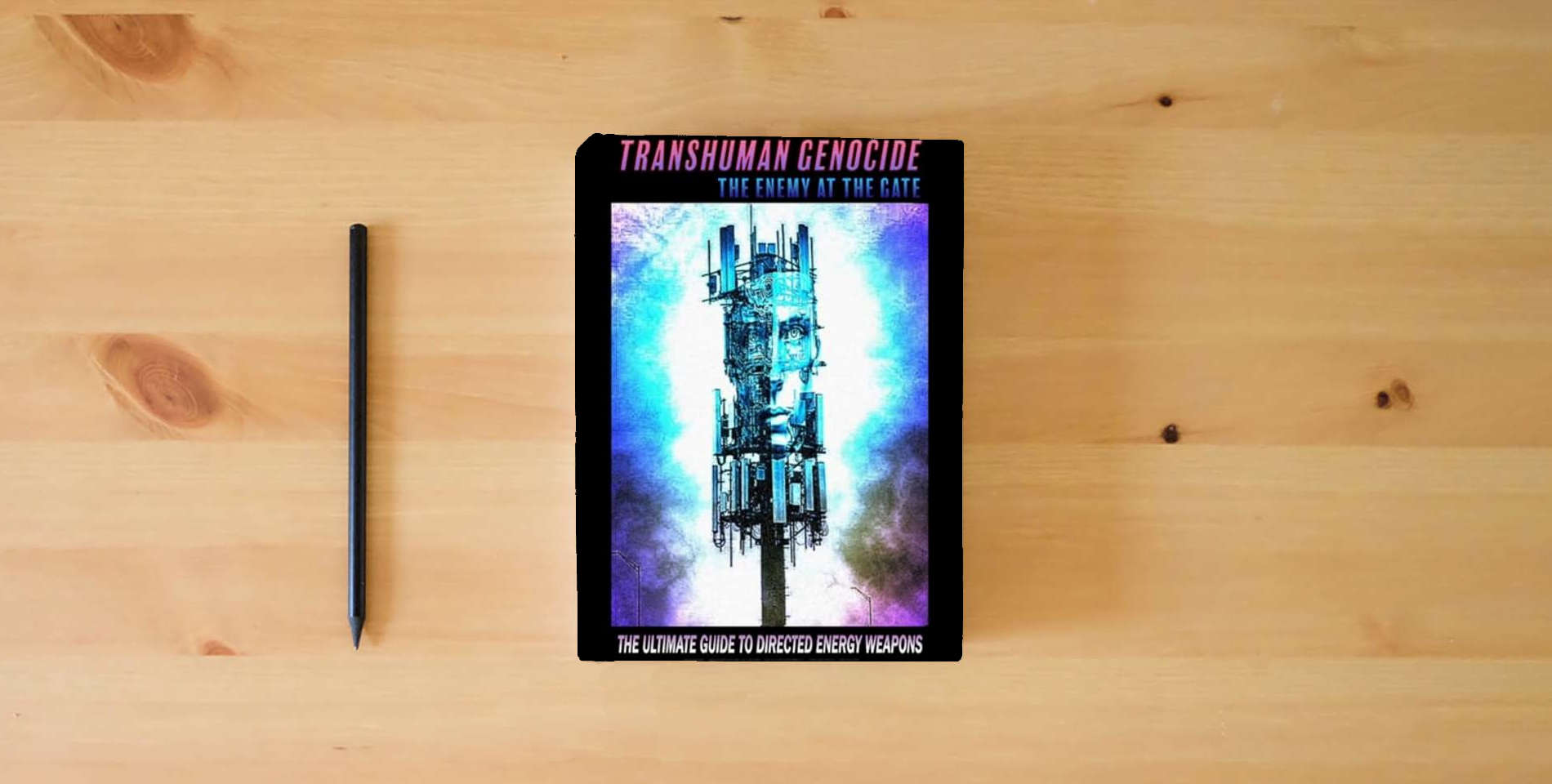 The book TRANSHUMAN GENOCIDE - THE ENEMY AT THE GATE: THE ULTIMATE GUIDE TO EMF SHIELDING, DIRECTED ENERGY WEAPONS AND ARTIFICIAL INTELLIGENCE is on the table