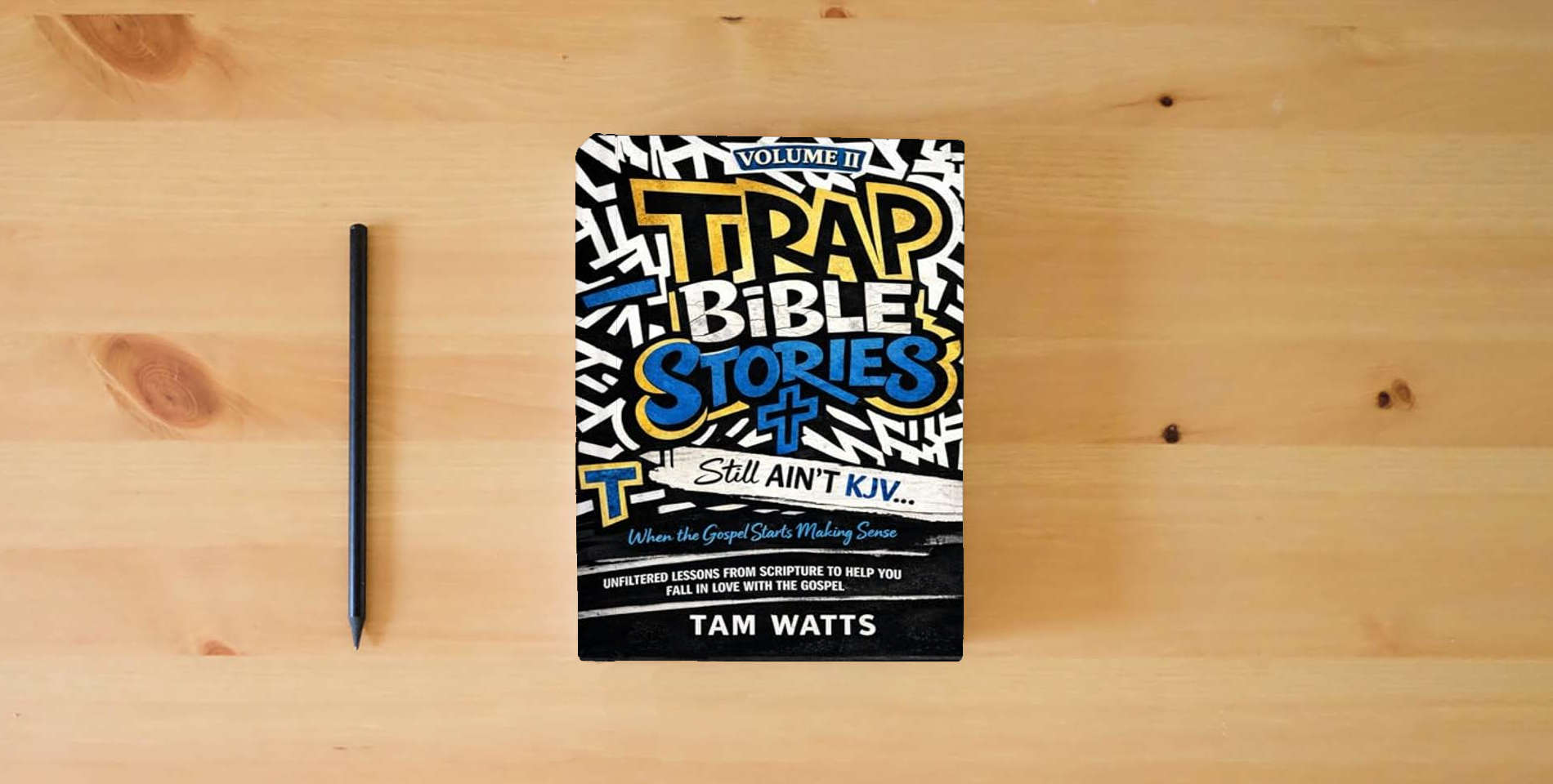 The book Trap Bible Stories: Volume II: Still AINT KJV… When the Gospel Starts Making Sense (Trap Bible Stories : The Collection) is on the table