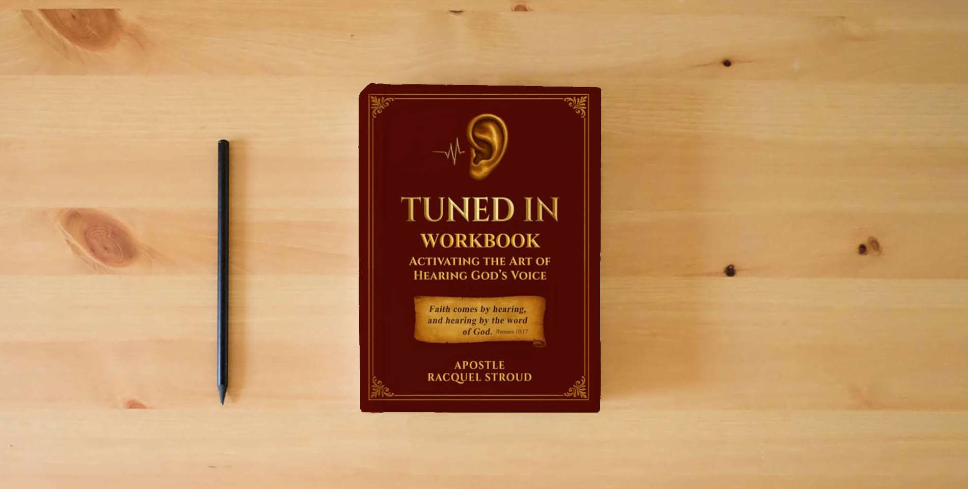 The book Tuned In Workbook: Activating the Art of Hearing God's Voice is on the table