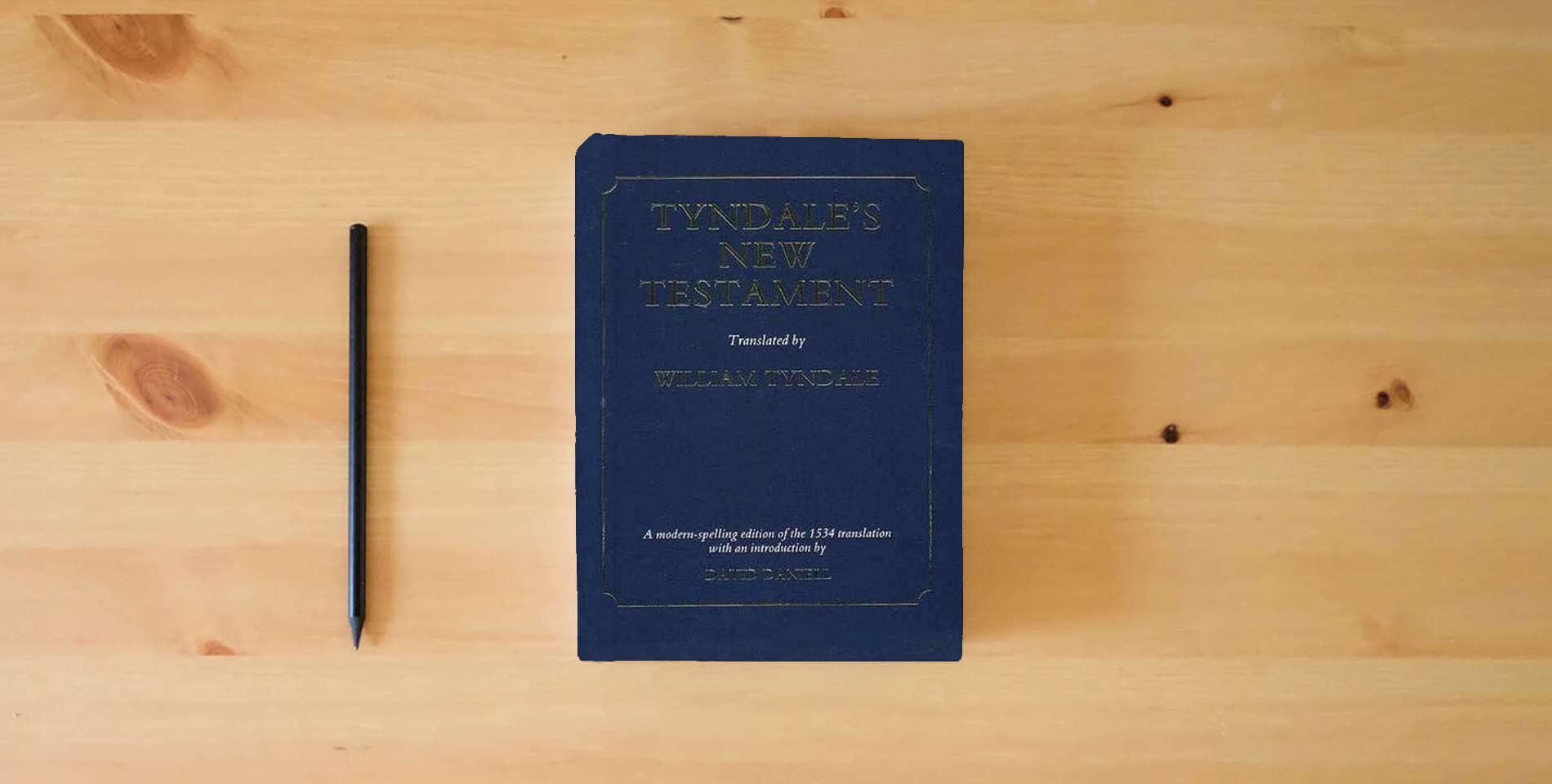 The book Tyndale's New Testament is on the table
