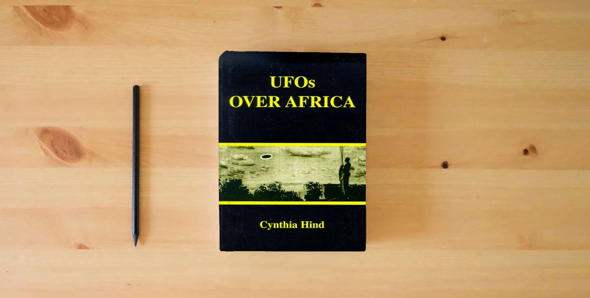 The book Ufos Over Africa is on the table