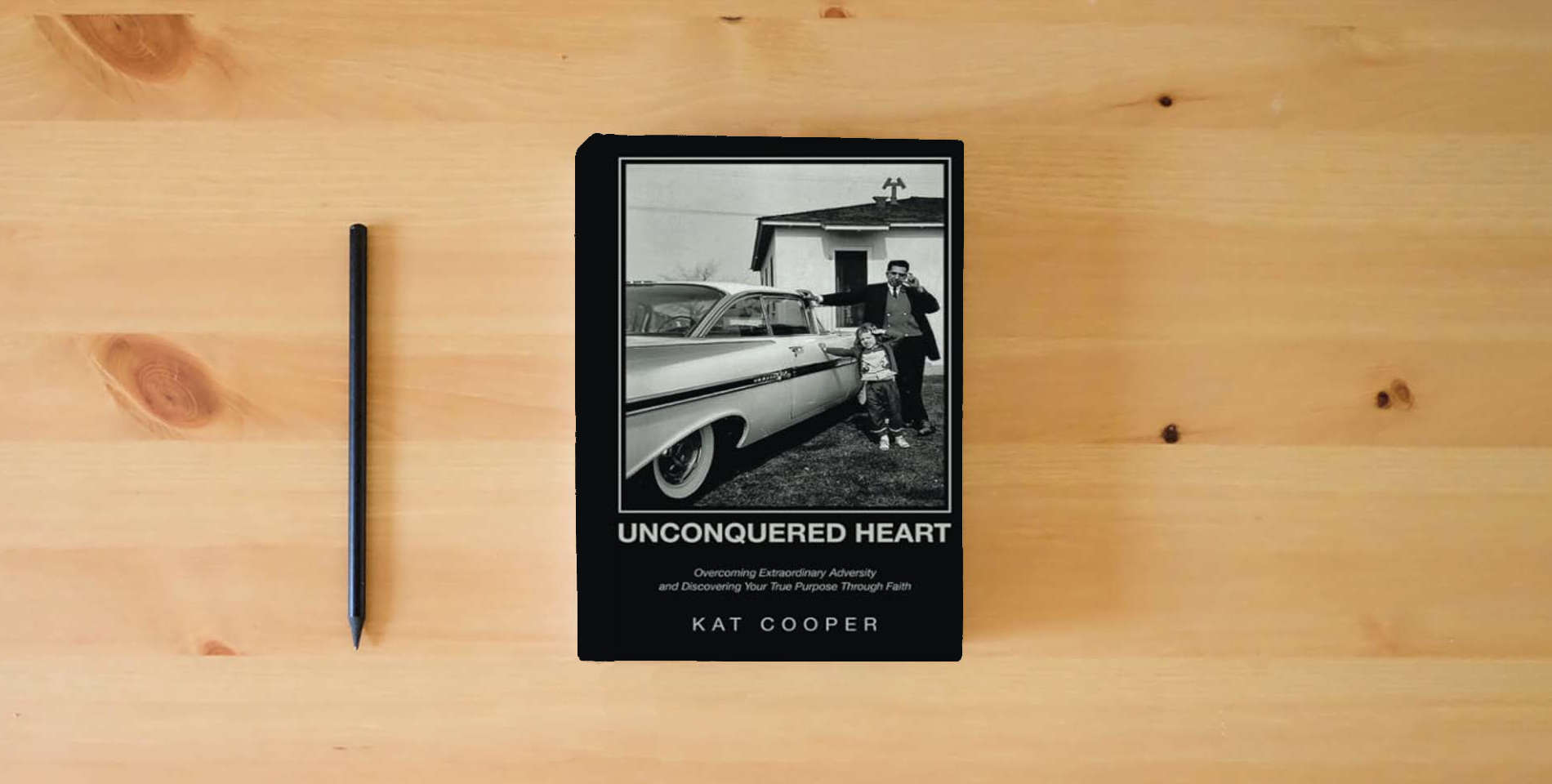 The book Unconquered Heart: Overcoming Extraordinary Adversity and Discovering Your True Purpose Through Faith is on the table