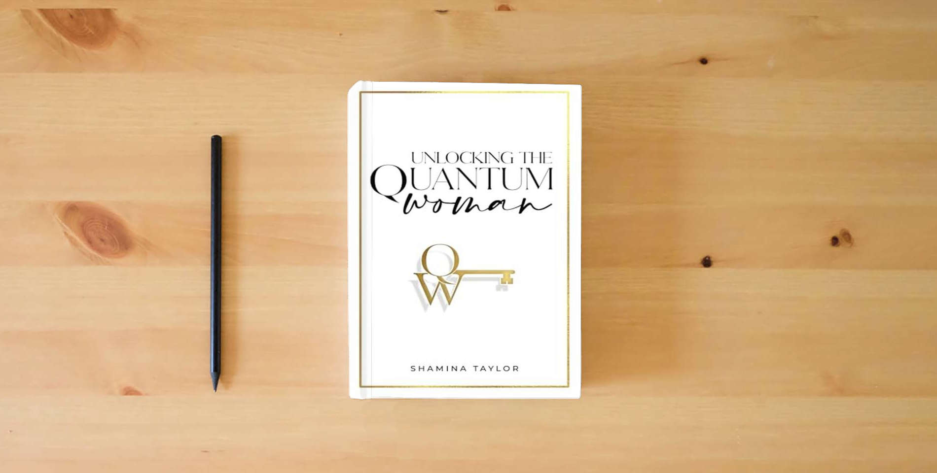 The book Unlocking The Quantum Woman: Four Keys to Opening the Life of your Dreams is on the table