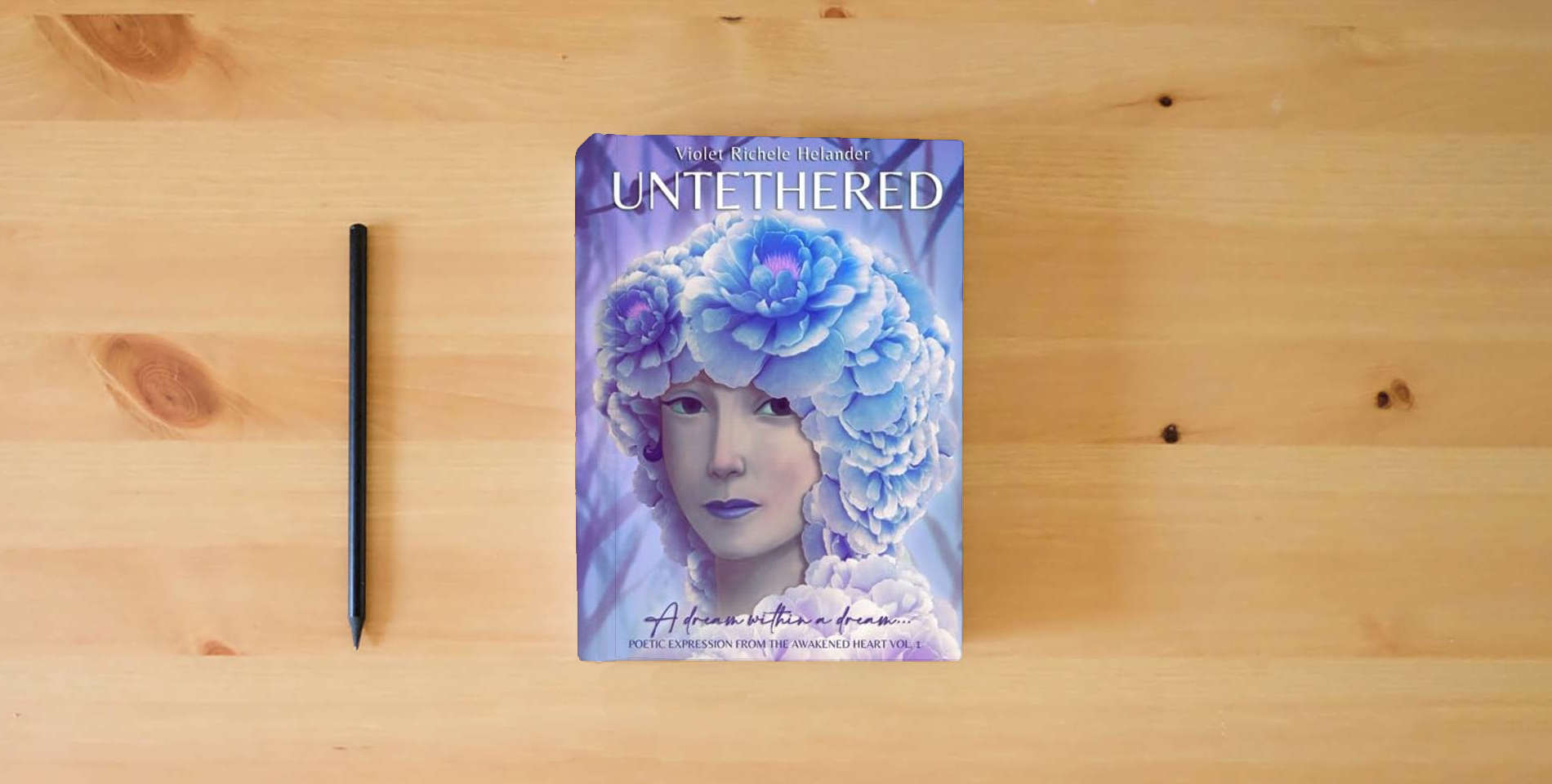 The book Untethered (XL): A dream within a dream... (Poetic Expression from the Awakened Heart) is on the table