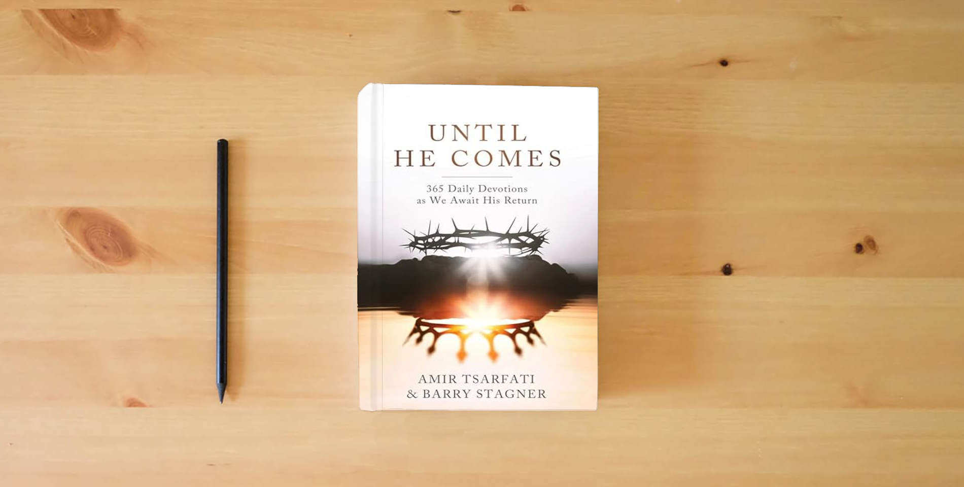 The book Until He Comes: 365 Daily Devotions as We Await His Return is on the table