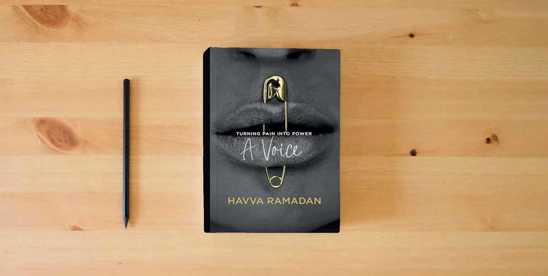 The book A Voice: Turning Pain into Power is on the table