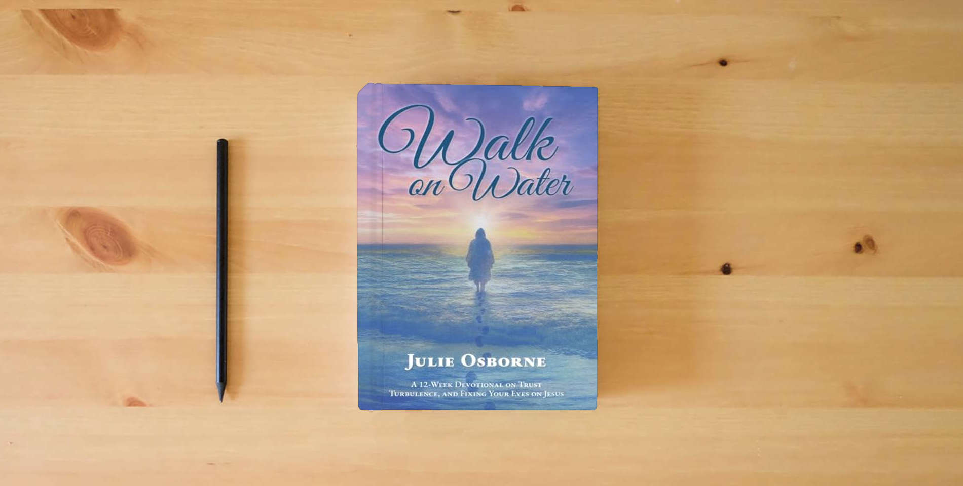 The book Walk on Water: A 12-Week Devotional on Trust, Turbulence, and Fixing Your Eyes on Jesus is on the table