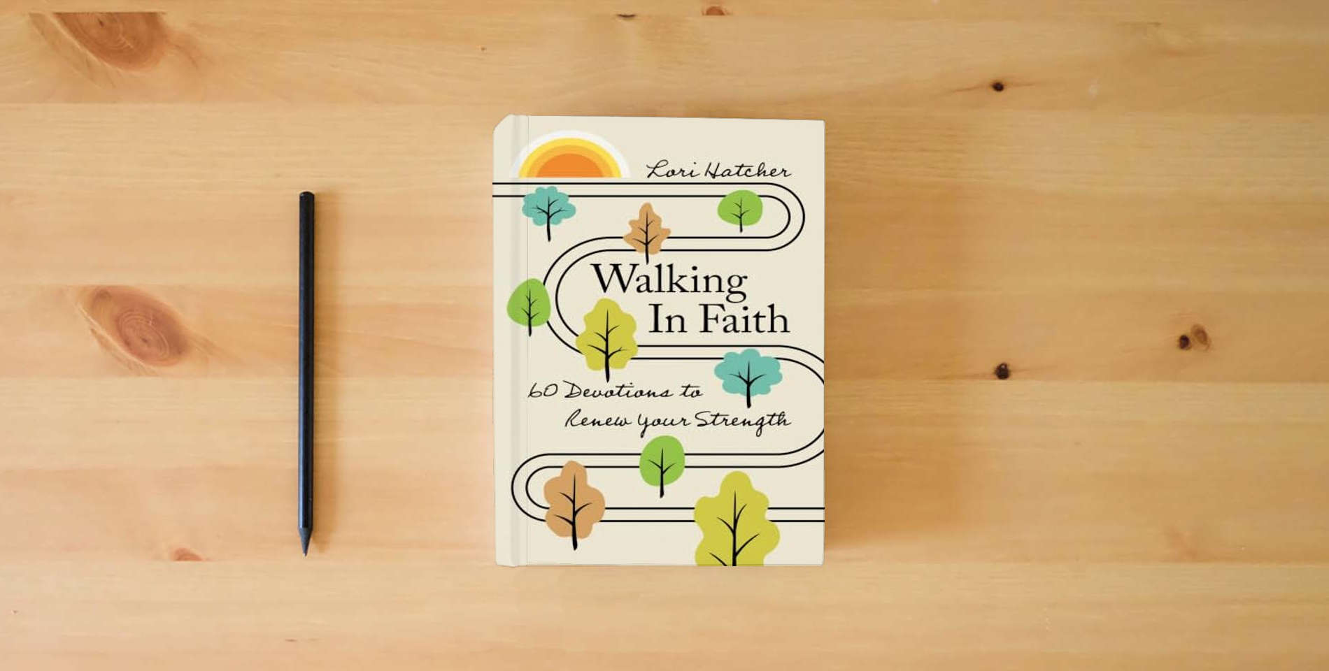 The book Walking in Faith: 60 Devotions to Renew Your Strength is on the table