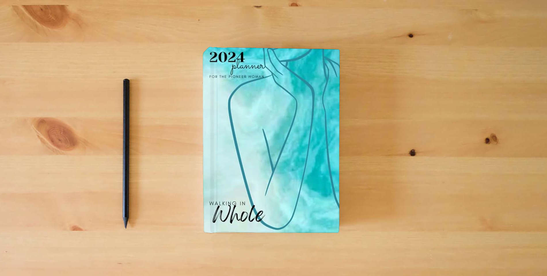 The book Walking In Whole-(12-Month) 2024 Planner: For the Pioneer Woman! is on the table