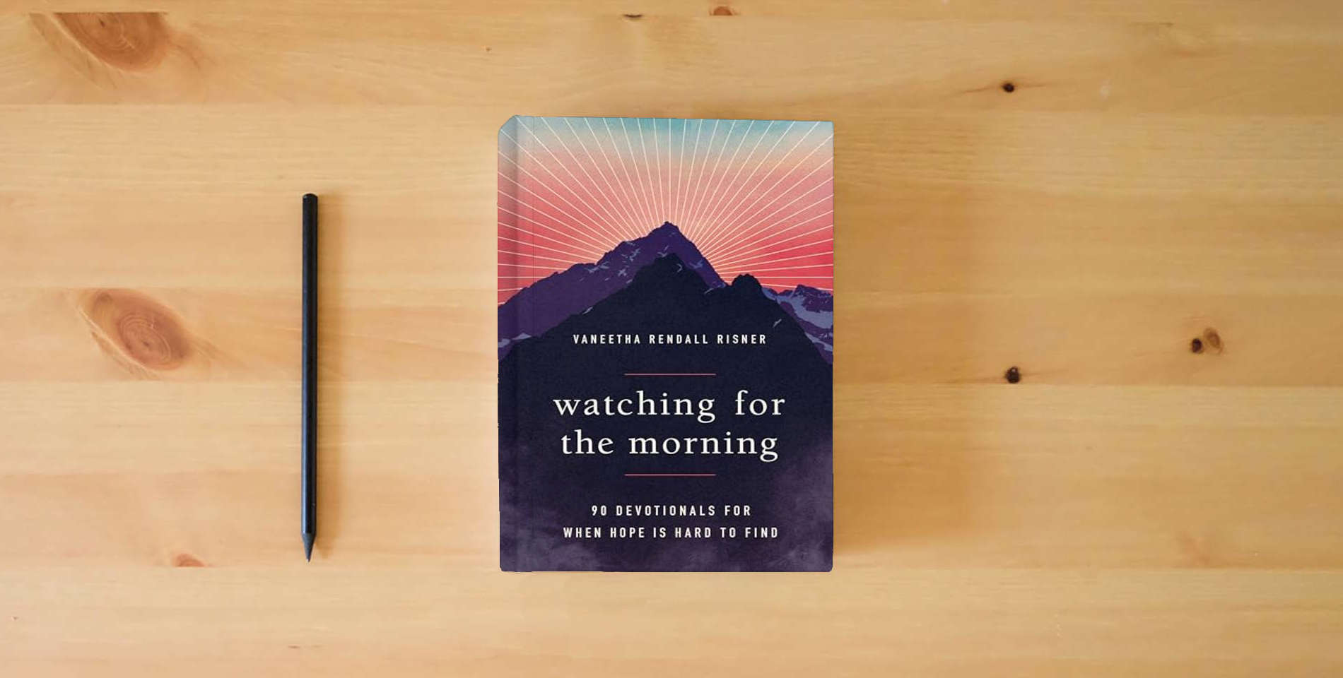 The book Watching for the Morning: 90 Devotionals for When Hope is Hard to Find is on the table