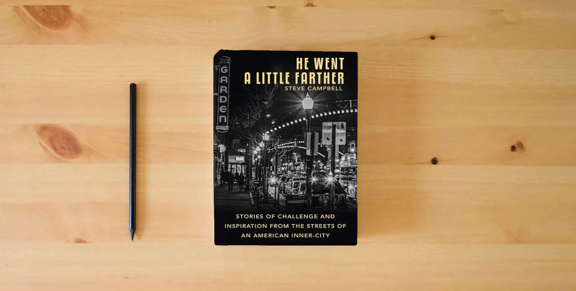 The book He Went a Little Farther: Stories of Challenge and Inspiration from the Streets of an American Inner-City is on the table