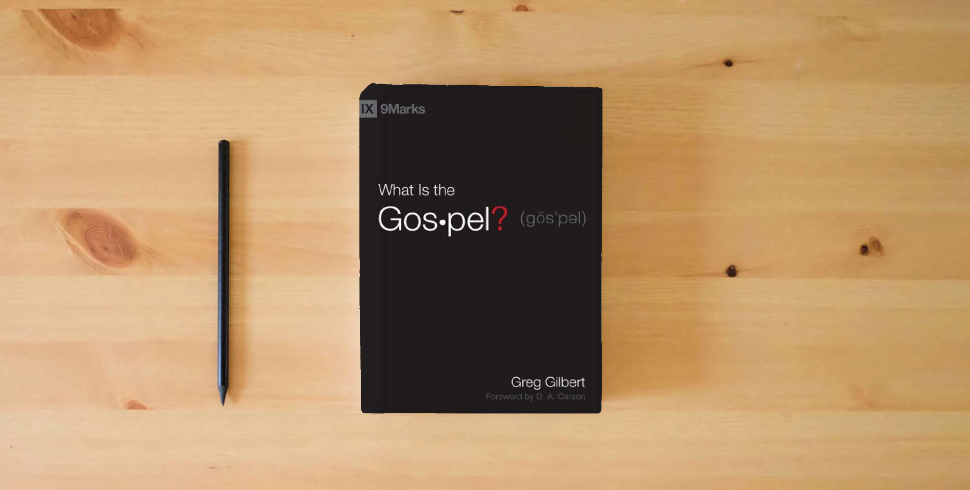 The book What Is the Gospel? (9Marks) is on the table
