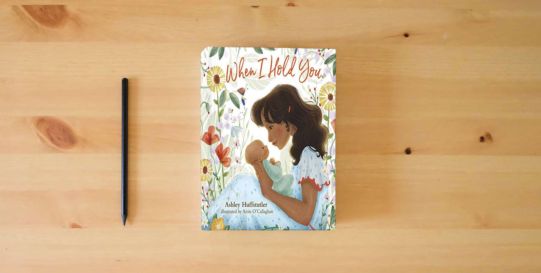 The book When I Hold You is on the table