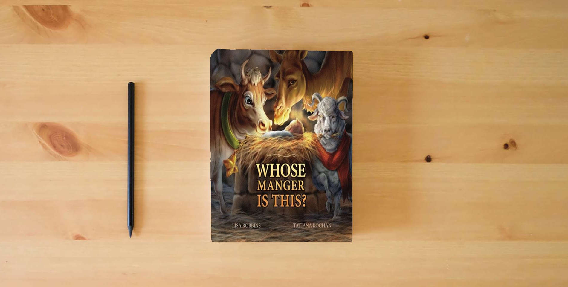 The book Whose Manger Is This? is on the table