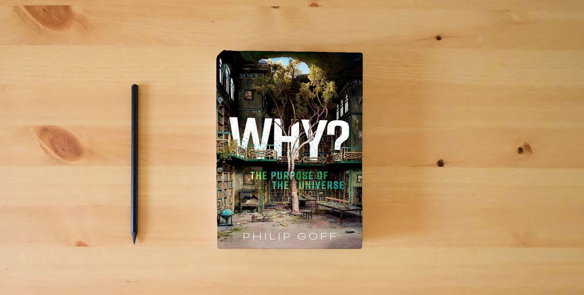 The book Why? The Purpose of the Universe is on the table