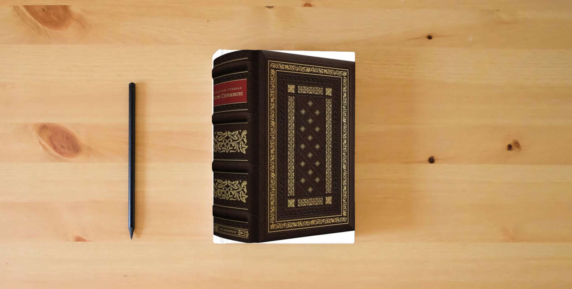 The book William Tyndale New Testament, 500th Anniversary Edition (Leather over Board) is on the table