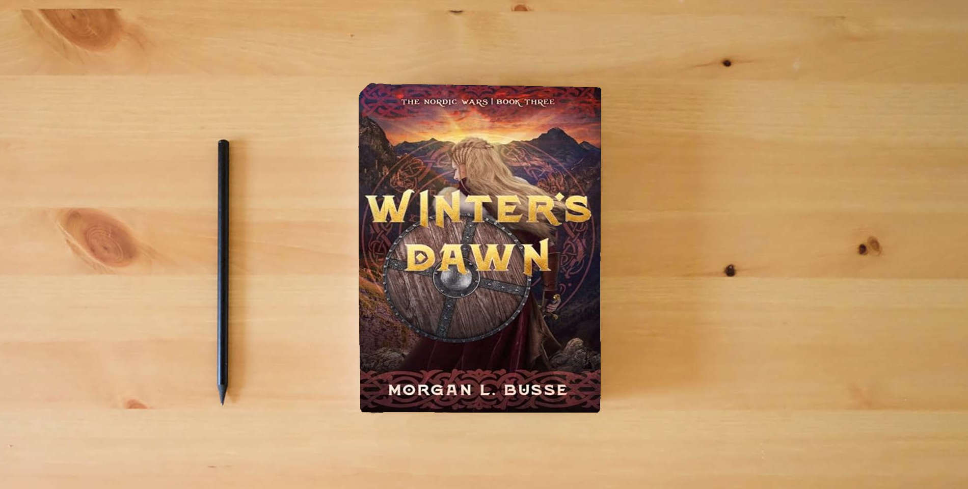 The book Winter's Dawn (Volume 3) (The Nordic Wars) is on the table