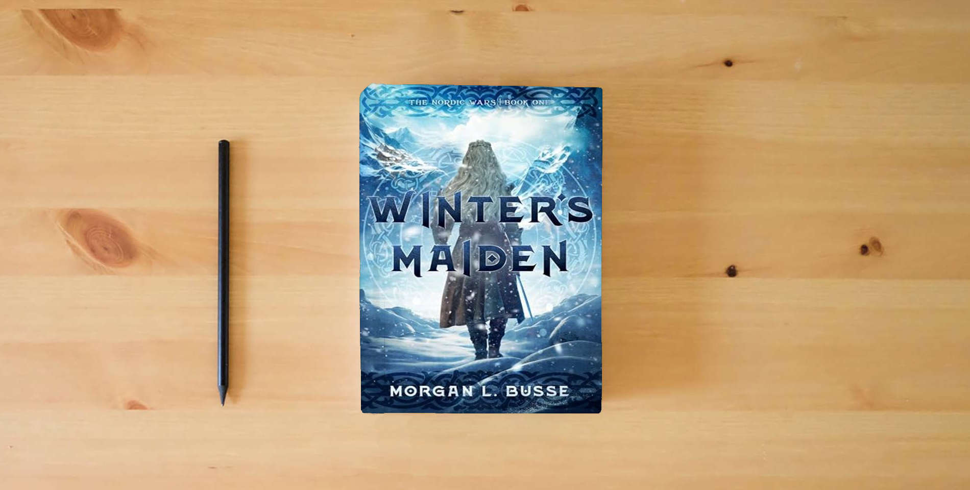The book Winter's Maiden (Volume 1) (The Nordic Wars) is on the table