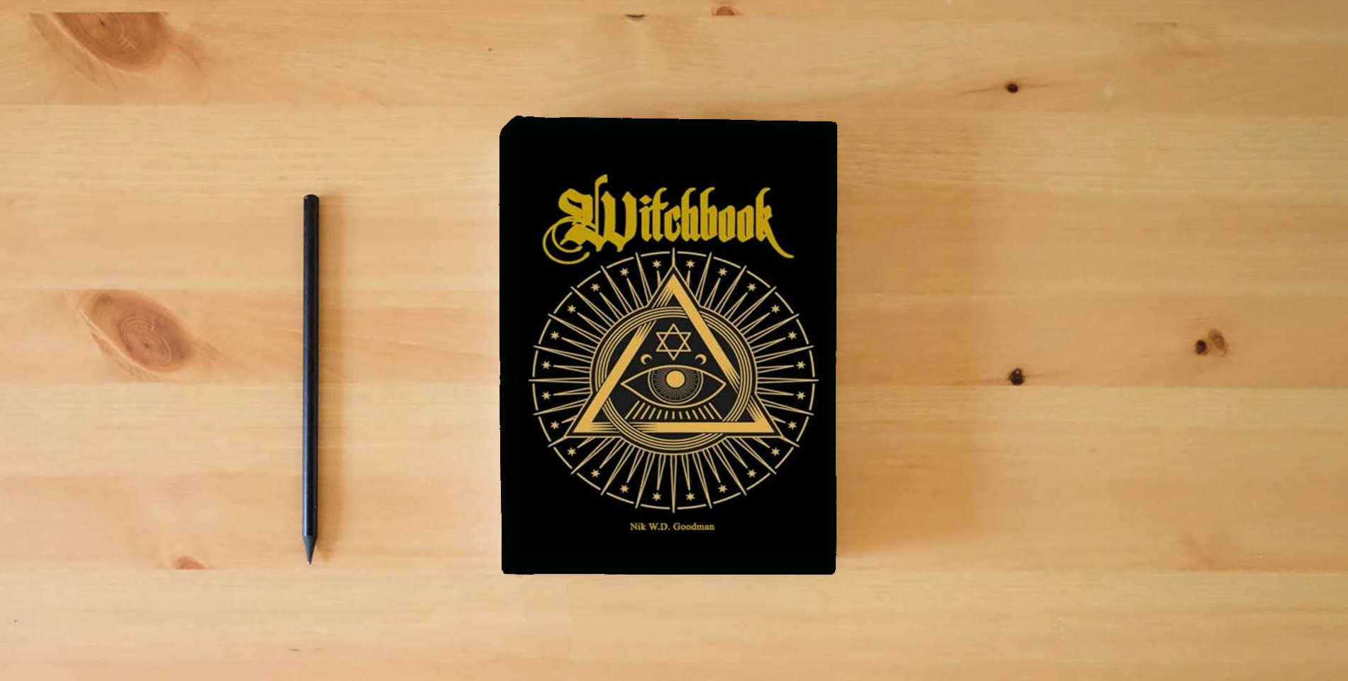 The book Witchbook: The Fundamental Book of Witchcraft in Theory – Knowledge – Practice – Rituals is on the table