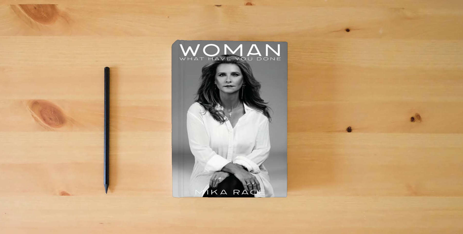 The book Woman is on the table