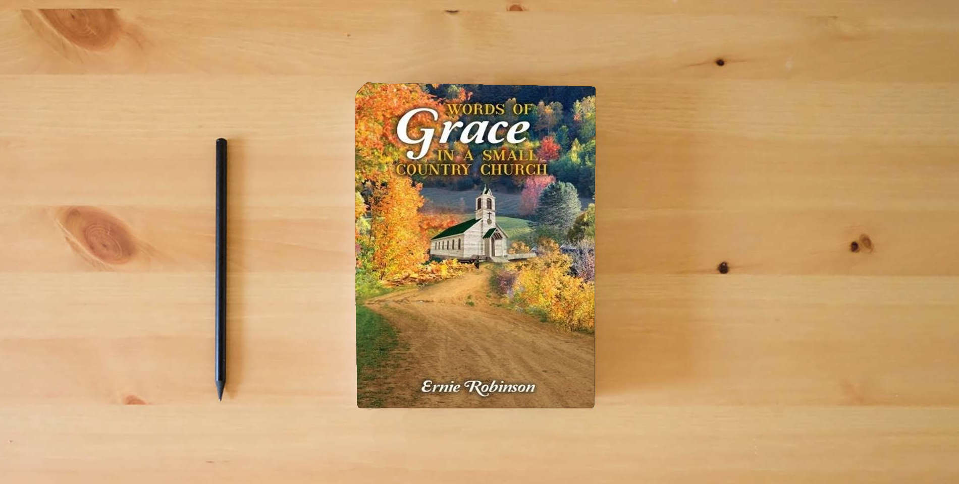 The book Words of Grace in a Small Country Church is on the table