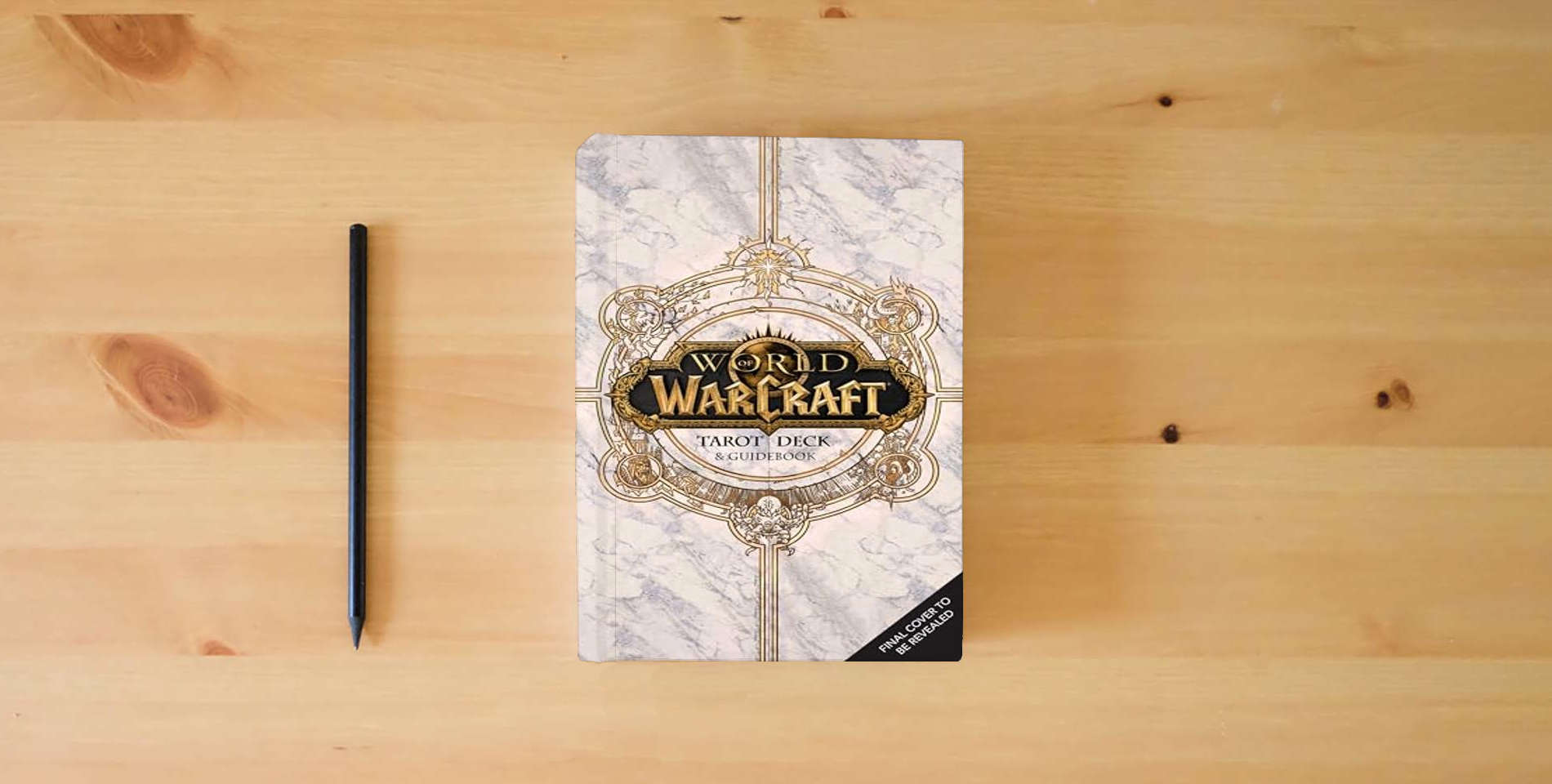 The book World of Warcraft: The Official Tarot Deck and Guidebook is on the table