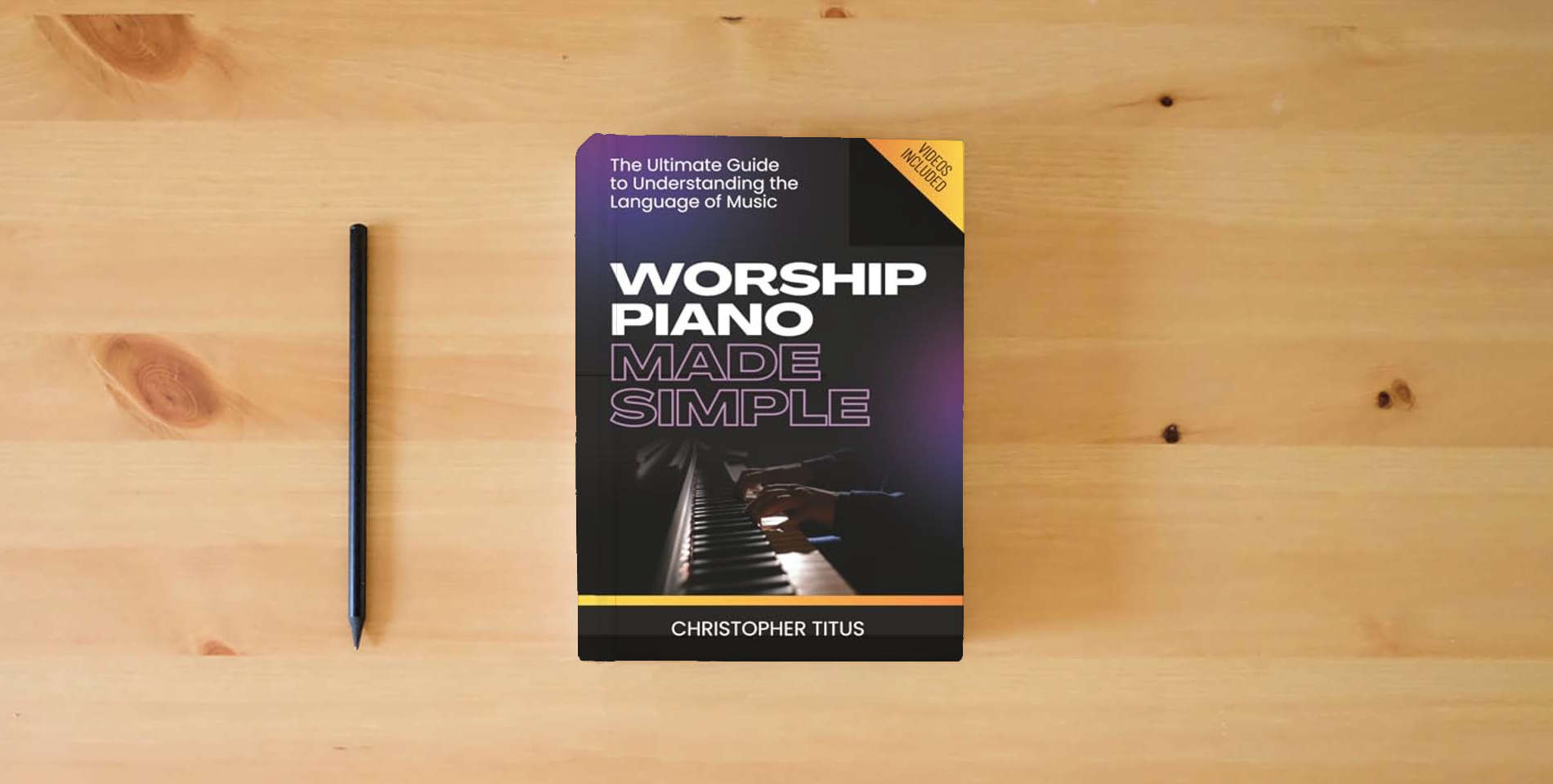 The book Worship Piano Made Simple is on the table