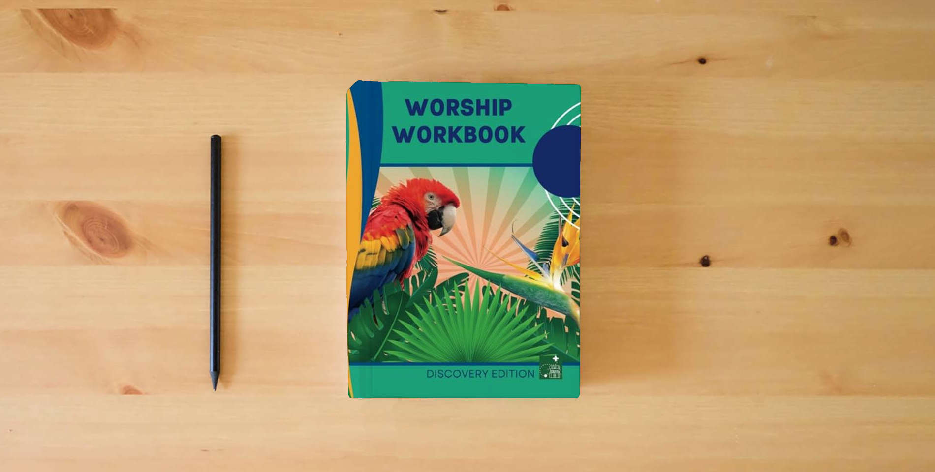 The book Worship Workbook: Discovery Edition is on the table