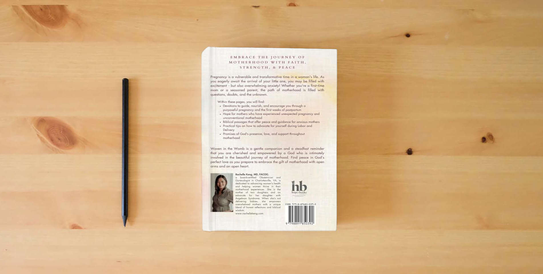 The book Woven in the Womb: Peace for the Pregnant and Postpartum Soul is on the table