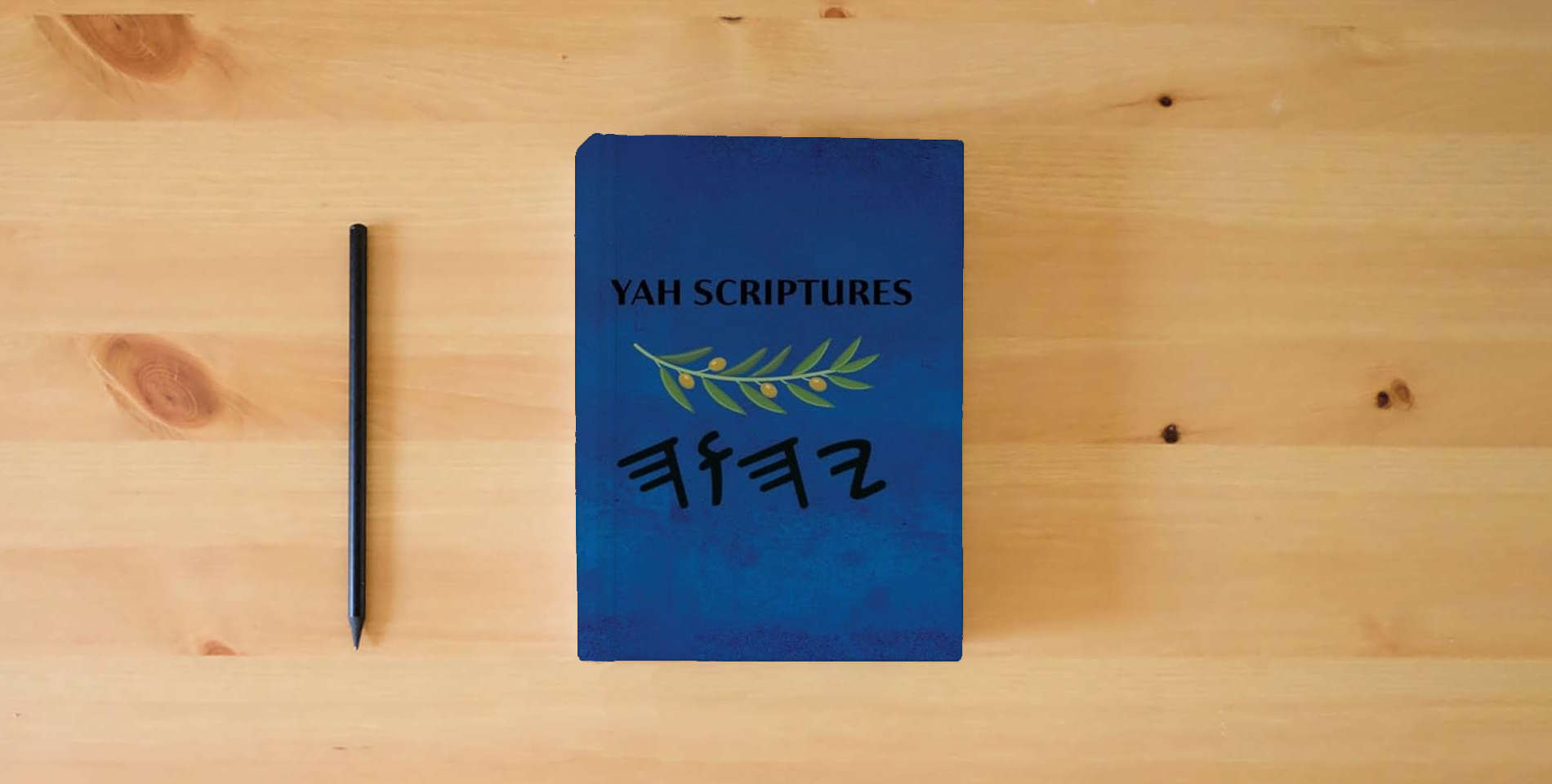 The book Yah Scriptures is on the table