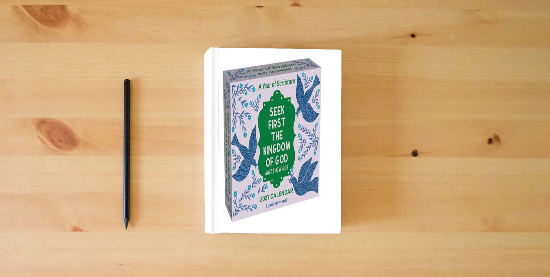 The book A Year of Scripture 2027 Day-to-Day Calendar: Seek First the Kingdom of God is on the table