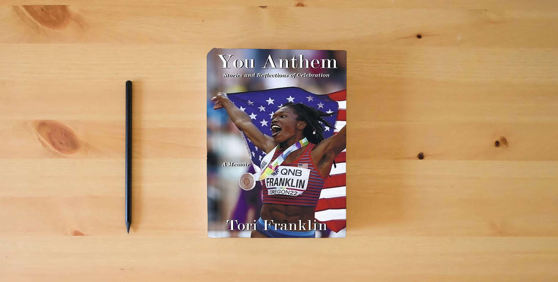 The book You Anthem: Stories and Reflections of Celebration is on the table