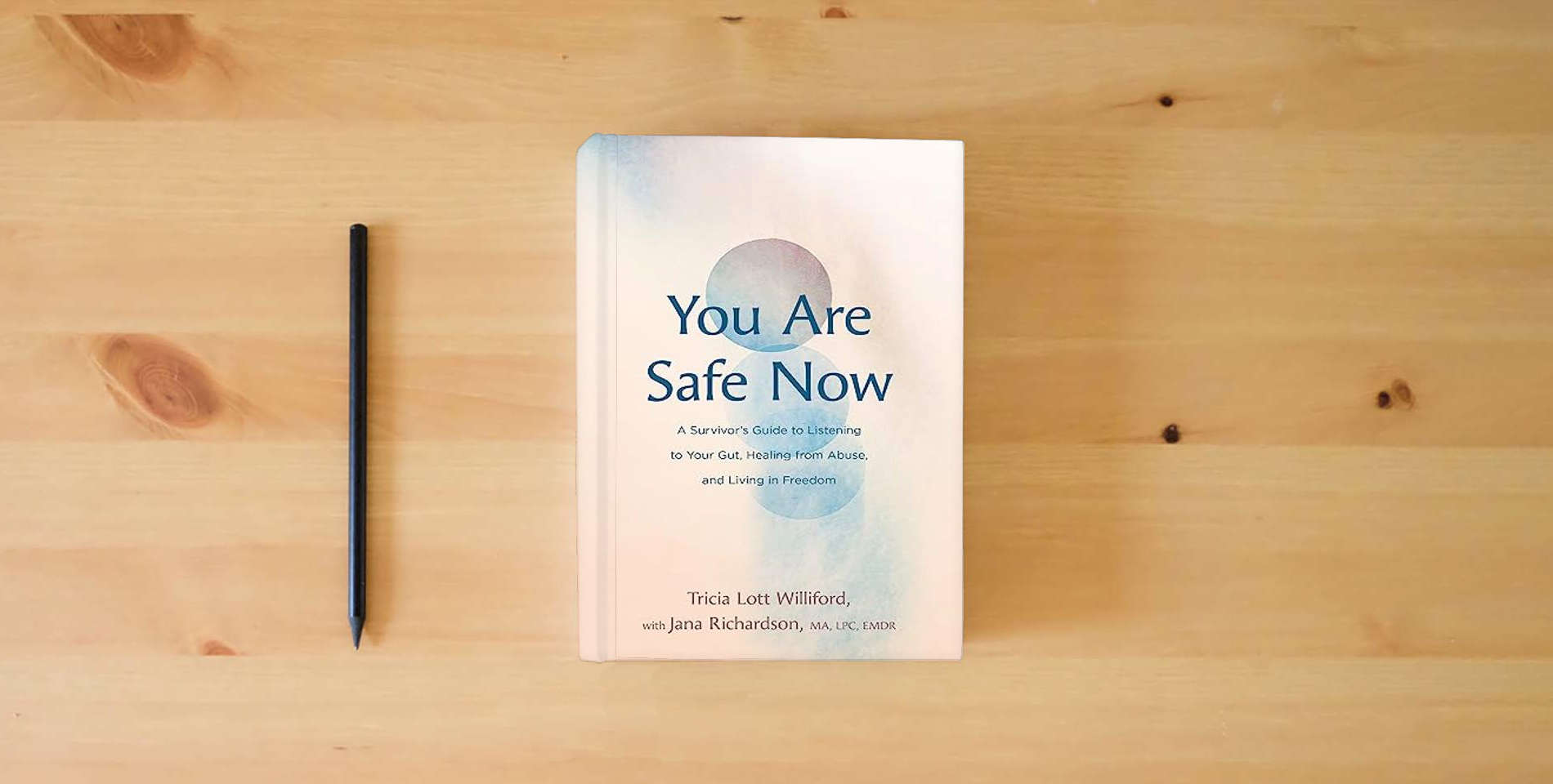 The book You Are Safe Now: A Survivor’s Guide to Listening to Your Gut, Healing from Abuse, and Living in Freedom is on the table