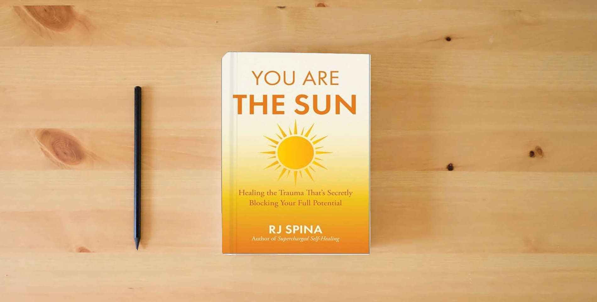 The book You Are the Sun: Healing the Trauma That's Secretly Blocking Your Full Potential is on the table