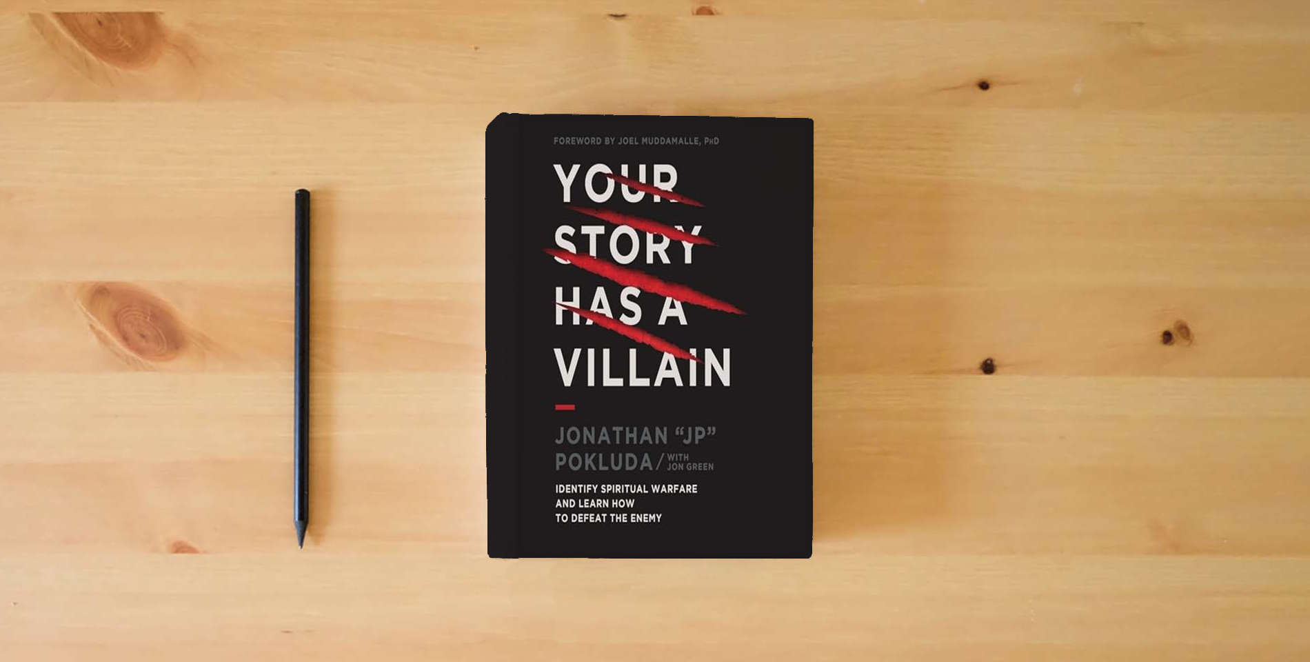 The book Your Story Has a Villain: Identify Spiritual Warfare and Learn How to Defeat the Enemy is on the table