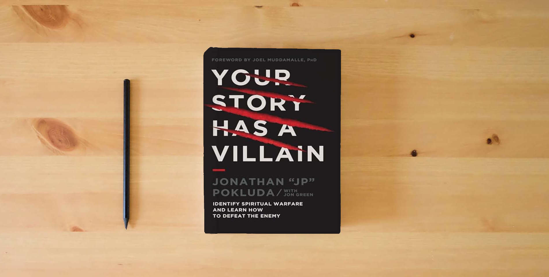 The book Your Story Has a Villain: Identify Spiritual Warfare and Learn How to Defeat the Enemy is on the table