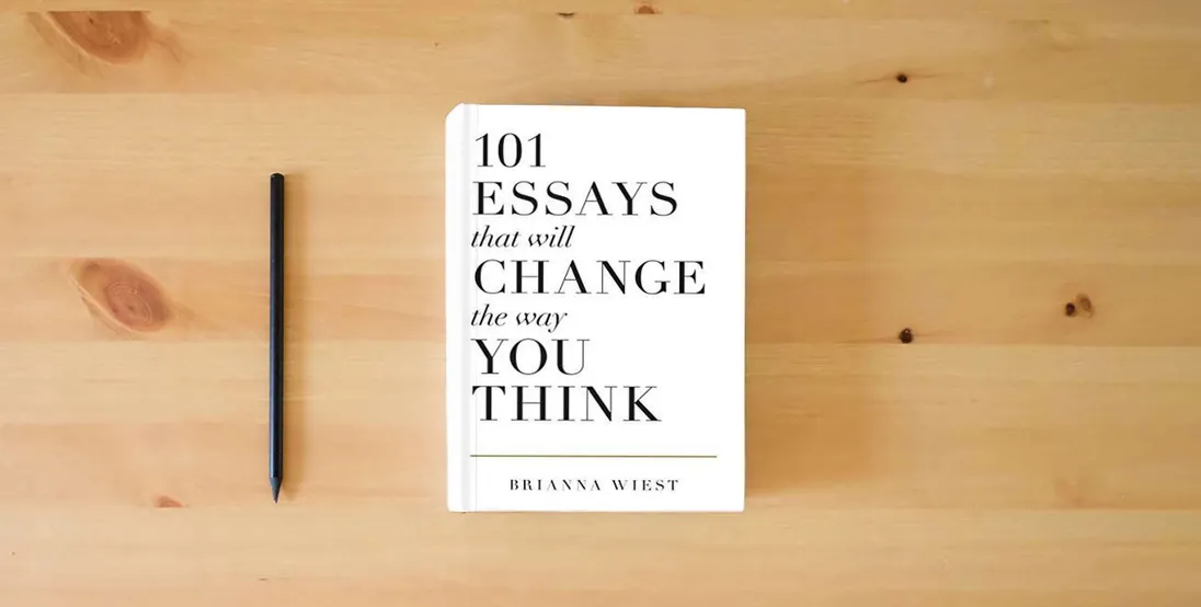 The book 101 Essays That Will Change The Way You Think} is on the table