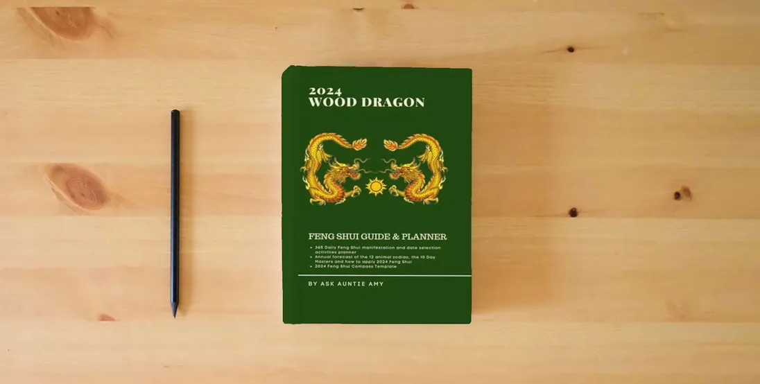 The book 2024 Wood Dragon Feng Shui Guide and Planner} is on the table