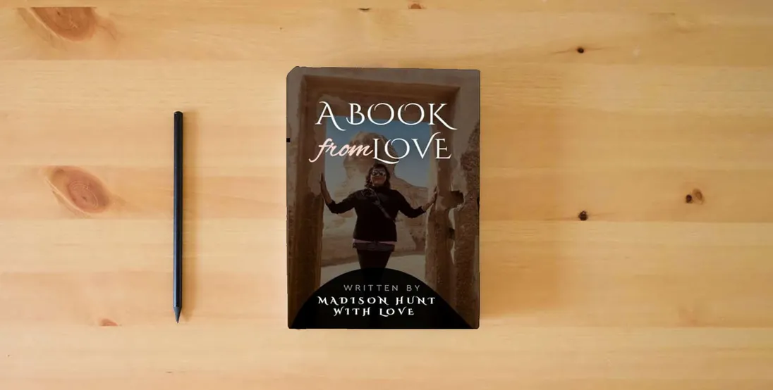 The book A Book From Love} is on the table