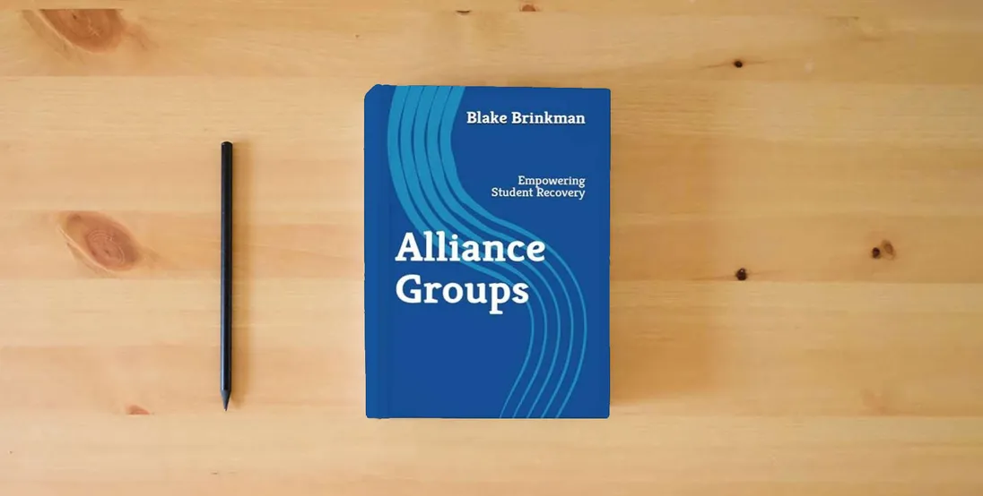 The book Alliance Groups: Empowering Student Recovery} is on the table