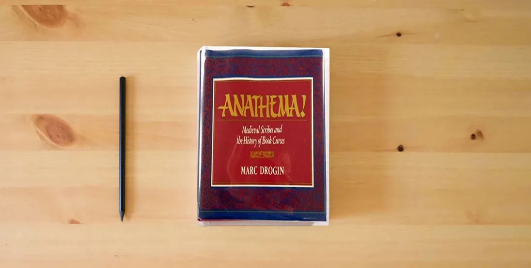 The book Anathema!: Medieval scribes and the history of book curses} is on the table