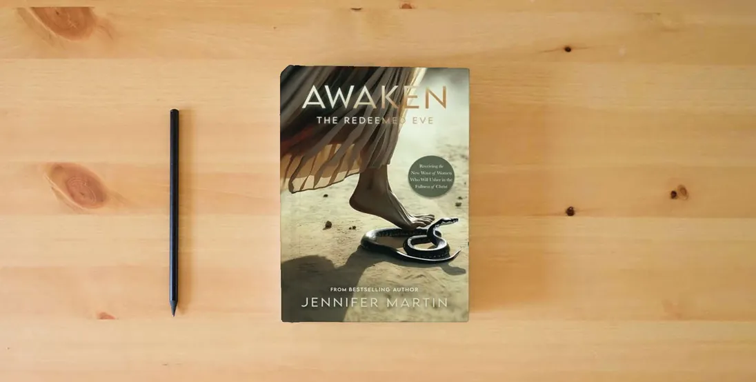 The book Awaken: The Redeemed Eve} is on the table