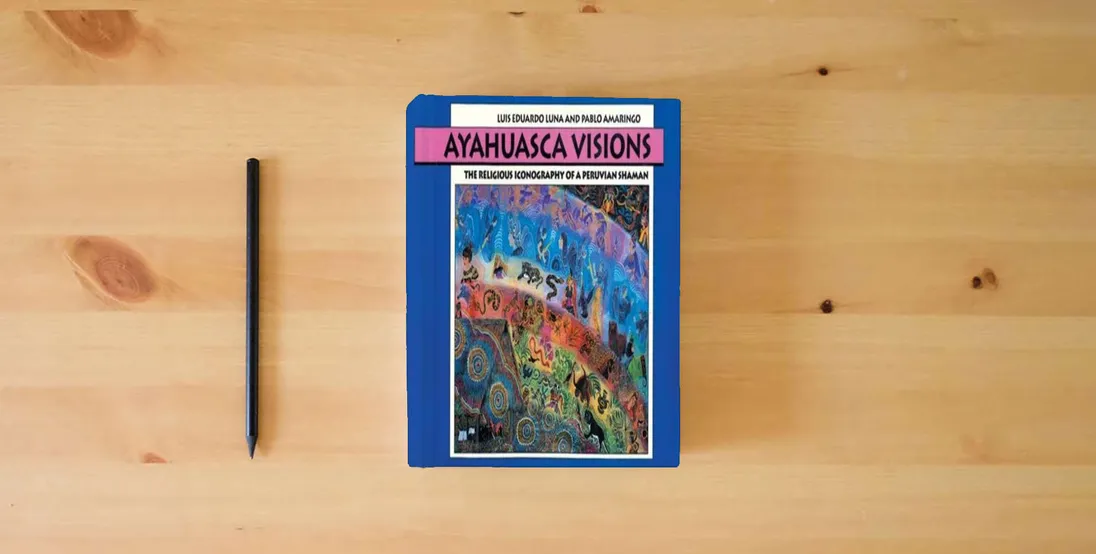 The book Ayahuasca Visions: The Religious Iconography of a Peruvian Shaman} is on the table